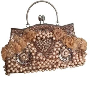 Beaded and ruffled peach clutch purse with silver handle